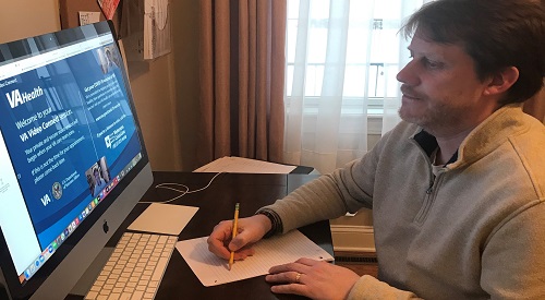 Navy Veterans Conan O’Rourke using the VA Telehealth system to connected to healthcare providers from his home.