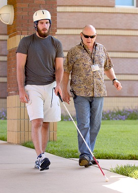 Caregiver assisting a TBI survivor Caregiver assisting a TBI survivor